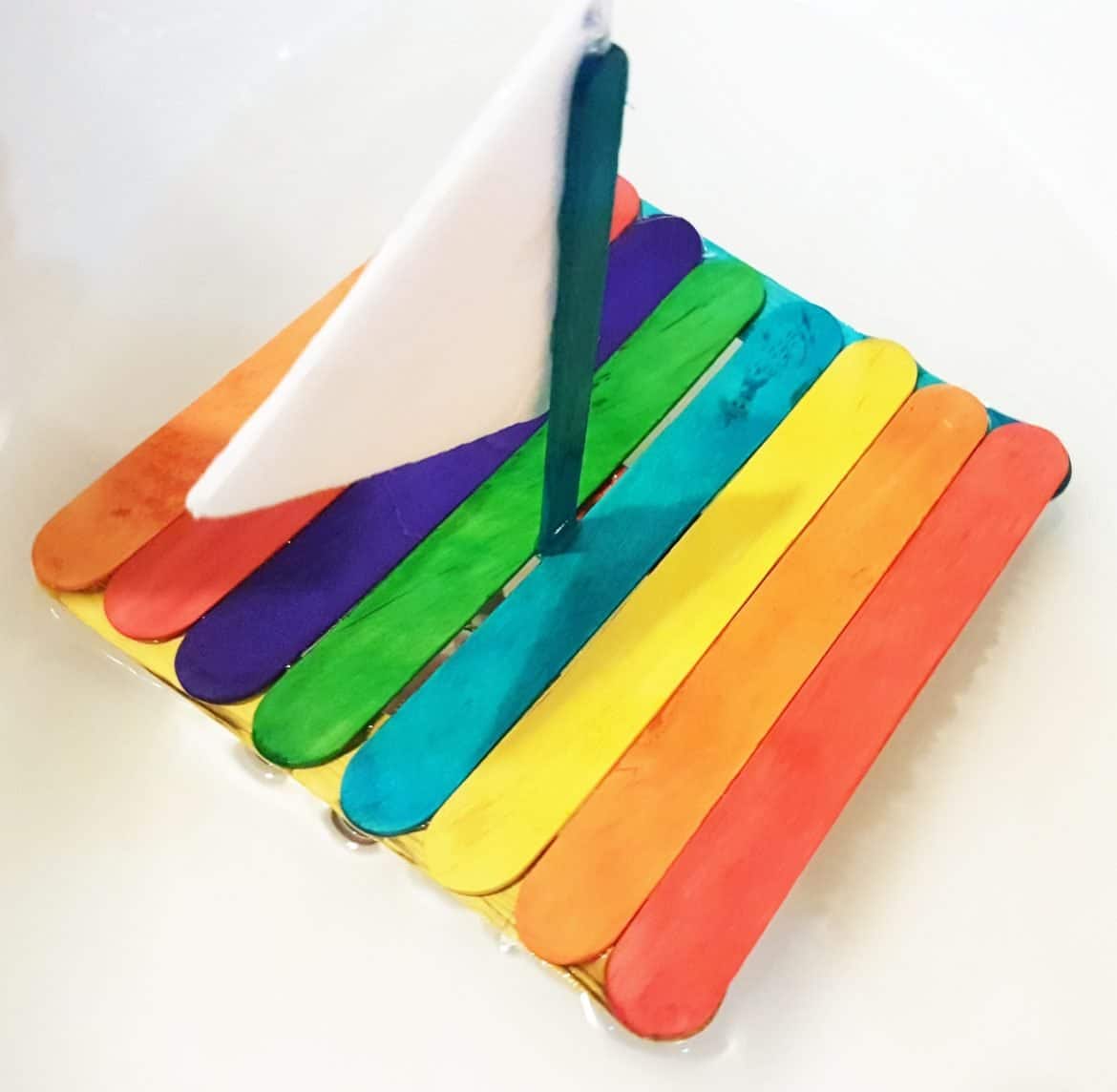 This incredible Rainbow Floating Raft is perfect for a hot summer day! #summercrafts #boycrafts #raftcraft